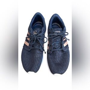 Women's Adidas running shoes in black with copper/rose gold metallic stripes